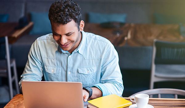 Adult student at a laptop.